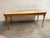 Classical styled writing table in antique butterscotch finish on maple solids and figured Sycamore veneer. Bronze finish...