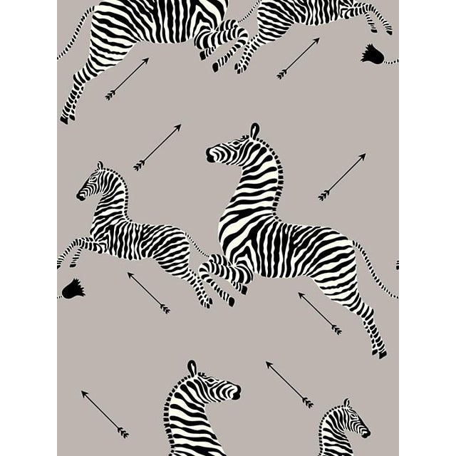 Scalamandre Zebras Silver Wallpaper Chairish Scalamandre zebra wallpaper adorns the walls of a contemporary bathroom featuring a black shaker washstand with honed marble countertops and marble basket weave floor tiles. scalamandre zebras silver wallpaper