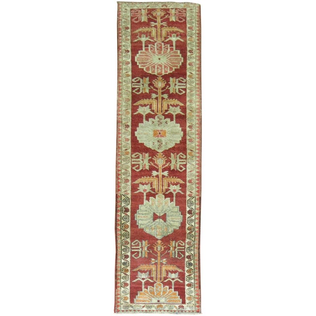 Narrow and long vintage Turkish Anatolian runner in a deep red tone 2'9'' x 13'7''