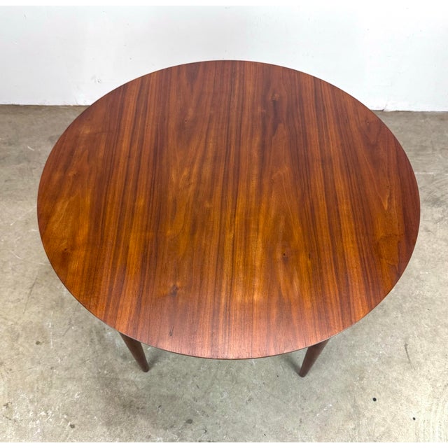 A beautiful walnut mid century modern side table made even more beautiful with a newly restored top, bringing out the...