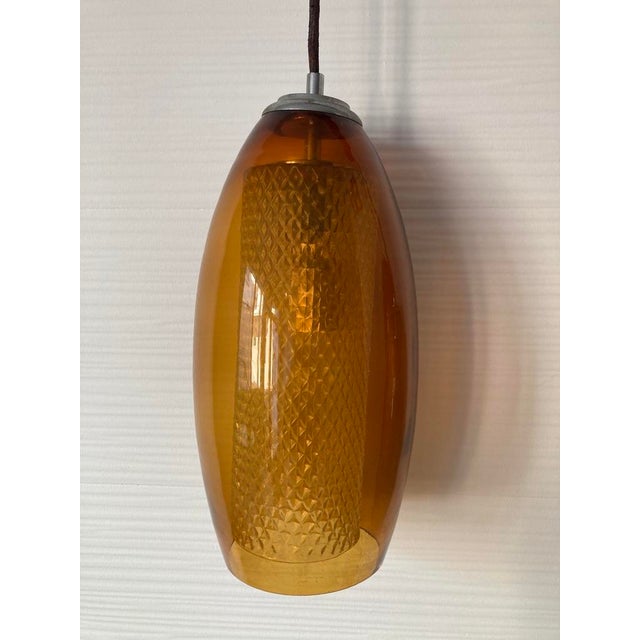 Lamp with Three Colored Glass Globes, in Very Good conditions. Designed 1950 to 1959 Up to 250V (Europe/UK Standard).The...