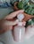 Charming mid-century rose opaline glass perfume bottle with a rounded stopper and soft, milky pink tone. The glass has a...
