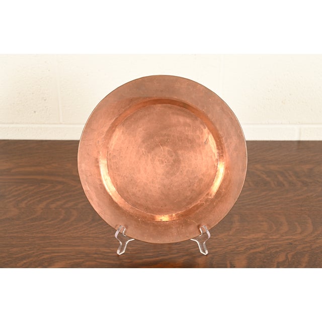 A gorgeous Arts & Crafts period hand hammered copper charger, large plate, or tray In the manner of Roycroft USA, Early...