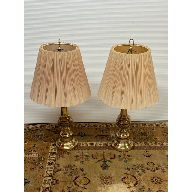 Design Plus Gallery presents a Pair of Stiffel Table Lamps. The lamps are from the mid to late 20th century and have cast...