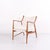 Lounge chair designed by finn juhl in 1952. The chair is crafted in walnut and upholstered in light fabric. The design has...