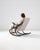This vintage wooden chair was produced in Czechia, circa 1960. A rocking armchair sculpted with bentwood, this classic...