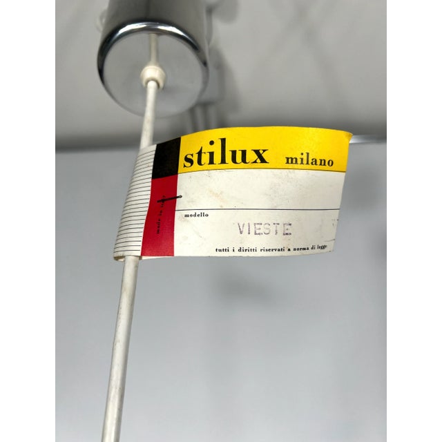 Excellent vintage condition for this set of two pendant lamps produced by Stilux Milano during the 70s. Made from chrome....