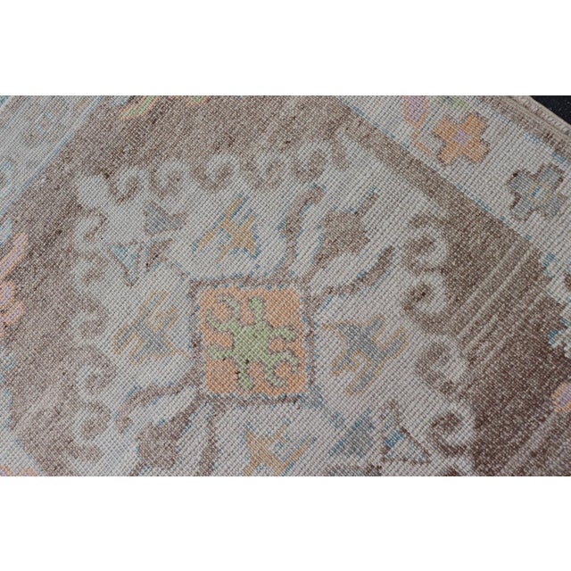 Long Turkish Oushak Runner With Pale Blue, Soft Yellow, and Light Brown Motifs For Sale - Image 9 of 13