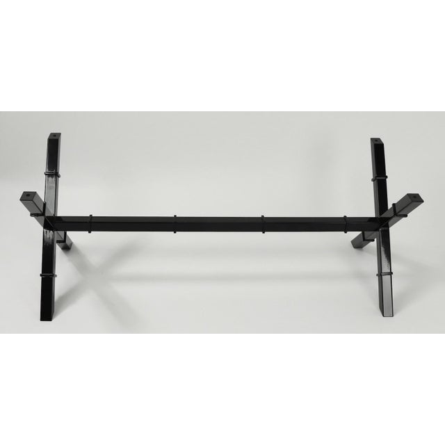 Sophisticated X base glass top coffee table with newly powder coated black metal base. Bold graphic form, chic voguish...