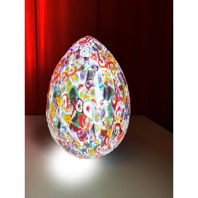 Murano multicolored millefiori Murrine make up this scenographic table lamp. Egg lamp, a shape that symbolizes birth and...