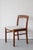 A set of six solid teak dining chairs showcasing beautiful joinery and a simple, elegent profile. Newly upholstered in a...