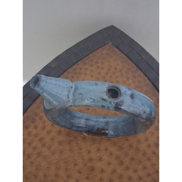 F-002 A modern interpretation of the traditional tavern ring jug. This decanter features a sculptural 'donut' form used...