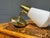 Gorgeous mid century modern hardwired wall sconce. Upscale brass fittings and a frosted atomic shaped shade. There is no...