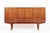 This vintage mid-century Danish modern teak high sideboard or bar cabinet attributed to E.W. Bach was produced in Denmark...