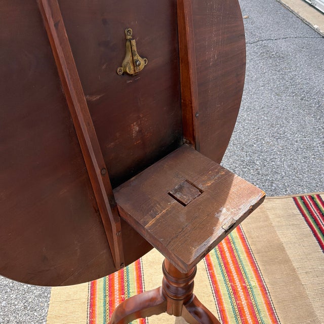 Antique English Mahogany Queen Anne Tilt Top Tea Table, Circa 1800–1820s A graceful and well-proportioned example of...