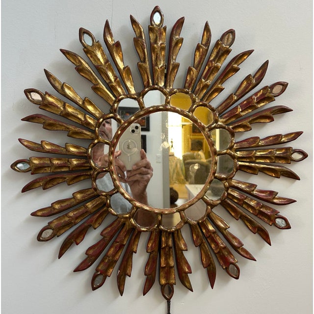 Bring timeless Italian elegance to your home with this beautifully hand-carved vintage giltwood sunburst mirror dating to...