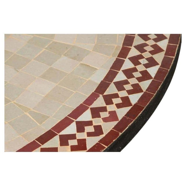 Handcrafted round Moroccan outdoor mosaic tile table 47 in. diameter on iron base. Classic and elegant vintage Moroccan...