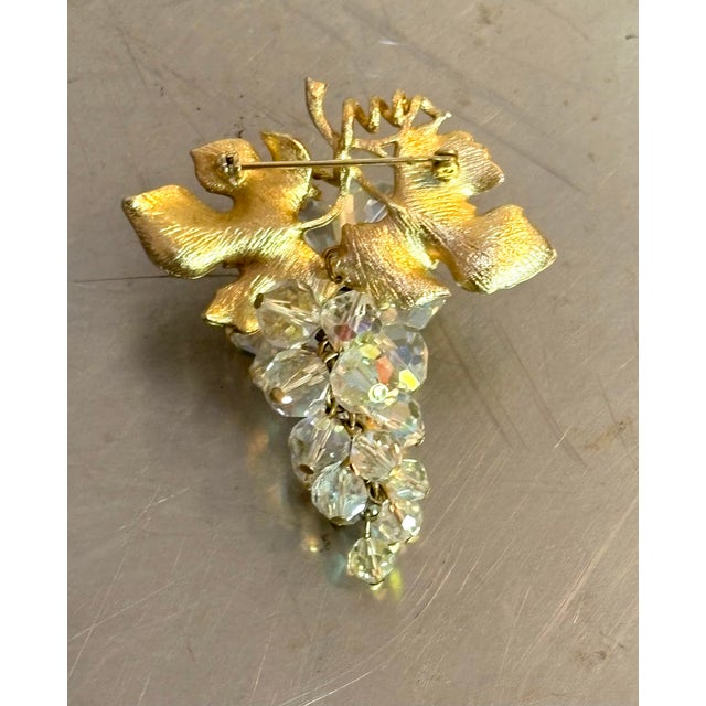 1950s-60s gold tone/clear bead grape bunch brooch. Excellent condition.
