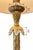 Elegant vintage table lamp featuring an ornate gold-tone sculptural metal body with intricate leaf and floral detailing....