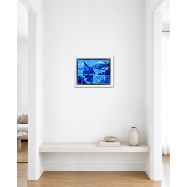 A graceful sailboat glides through the calm waters of a peaceful Mediterranean-inspired harbor in this original oil...