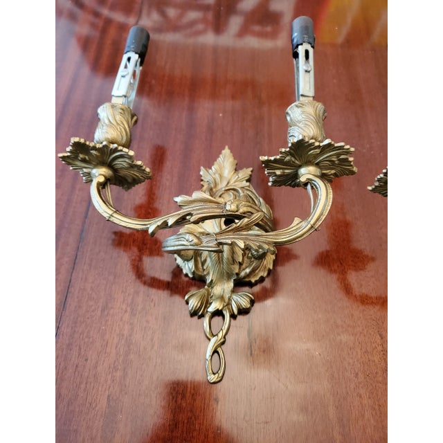 A nice pair of antique original French gilt bronze petite sconces. Having a diminutive and desirable size ( 9 inches high...