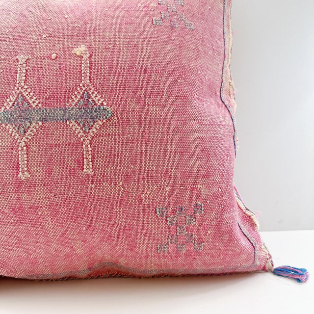 A handwoven, one-of-a-kind, Moroccan pillow made from cactus silk, vegetable silk, or Sabra silk. The silks are naturally...