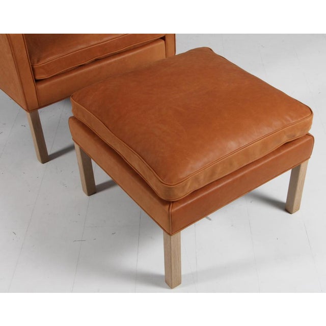 Børge Mogensen wingback chair with ottoman new upholstered with dunes aniline leather from Sørensen leather. Legs in teak....