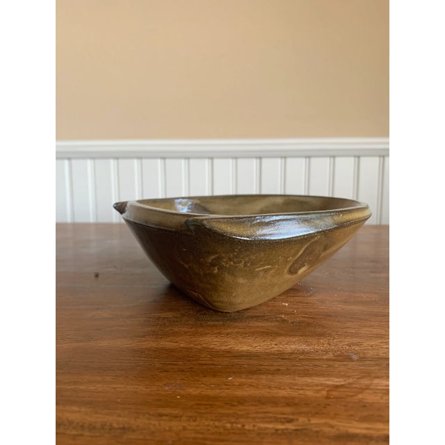A unique three sided bowl made by the contemporary ceramicist Matt Kelleher. He works with soda fired pottery and creates...
