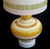A vibrant and large-scaled pair of Italian 1960's ovoid-shaped ceramic lamps with bold horizontal striping; each portly...