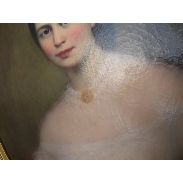 Beautifully painted mid-19th-century portrait of a young lady in a soft period fashion. Calm and composed sitter with an...