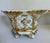 This elegant pair of porcelain jardinieres or cachepots dates to the late 19th to early 20th century and is executed in...