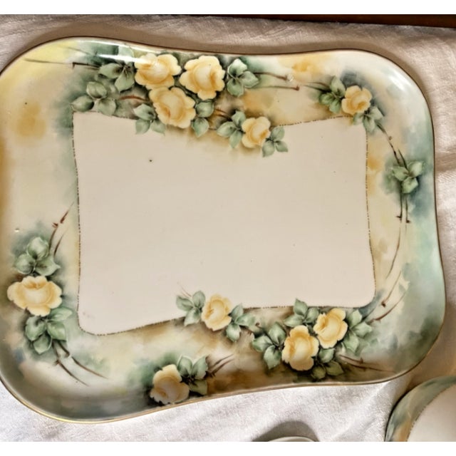 Exquisite Antique Leona Griffith for Vignaud Limoges Vanity Set This stunning four-piece vanity set features delicate...