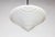 A large, beautifully shaped, streamlined, spinning top pendant; in milk glass with molded ribbed details on the point and...