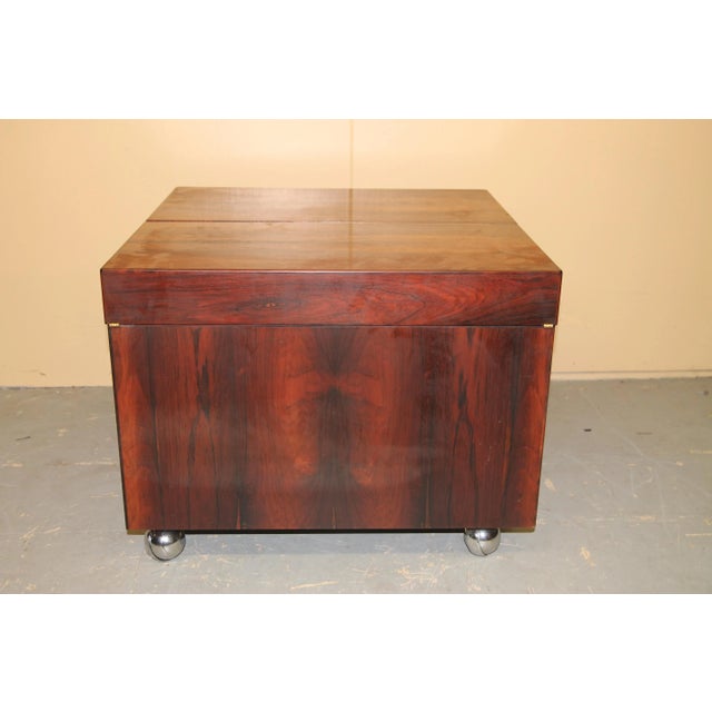 Rosewood cube bar. This serves as both a bar and coffee table. Bar is on wheels and when opened gives you ample storage...