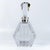 A striking mid-century cut crystal decanter of highly architectural form, likely French in origin, distinguished by its...
