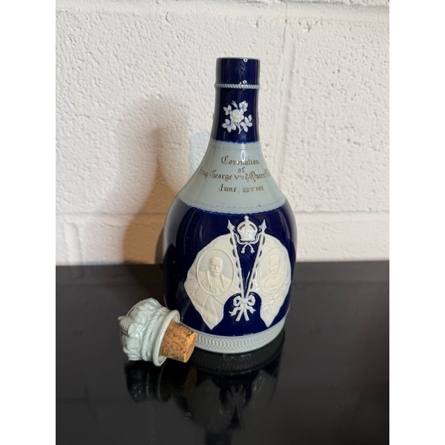 Antique ceramic whiskey decanter made in 1911 to commemorate the coronation of King George the fifth and Queen Mary on...