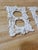 Mid-century design on these cast iron outlet covers. They appear to be salvaged and painted white.