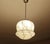Art Deco pendant light with ivory beige marble glass shade with darker veins, mounted on an chrome glass cover, rod and...