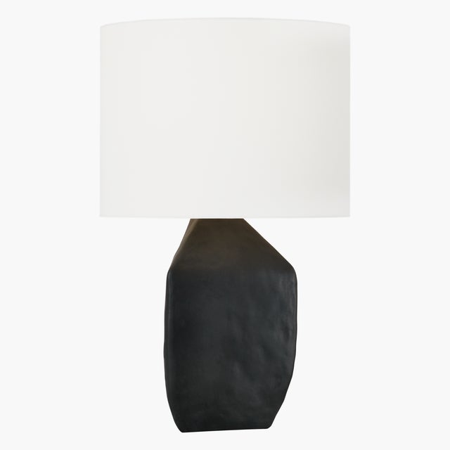The Sybert one-light table lamp by Hable is crafted with precision, and the ceramic base showcases artisanal...