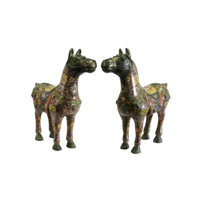 This is a pair of Fengshui horse accent display figures made of metal and covered with brown enamel color. There is...