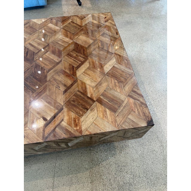 The stunning Made Goods Lesandro Coffee Table comprised of natural banana bark, arranged in a herringbone pattern across...
