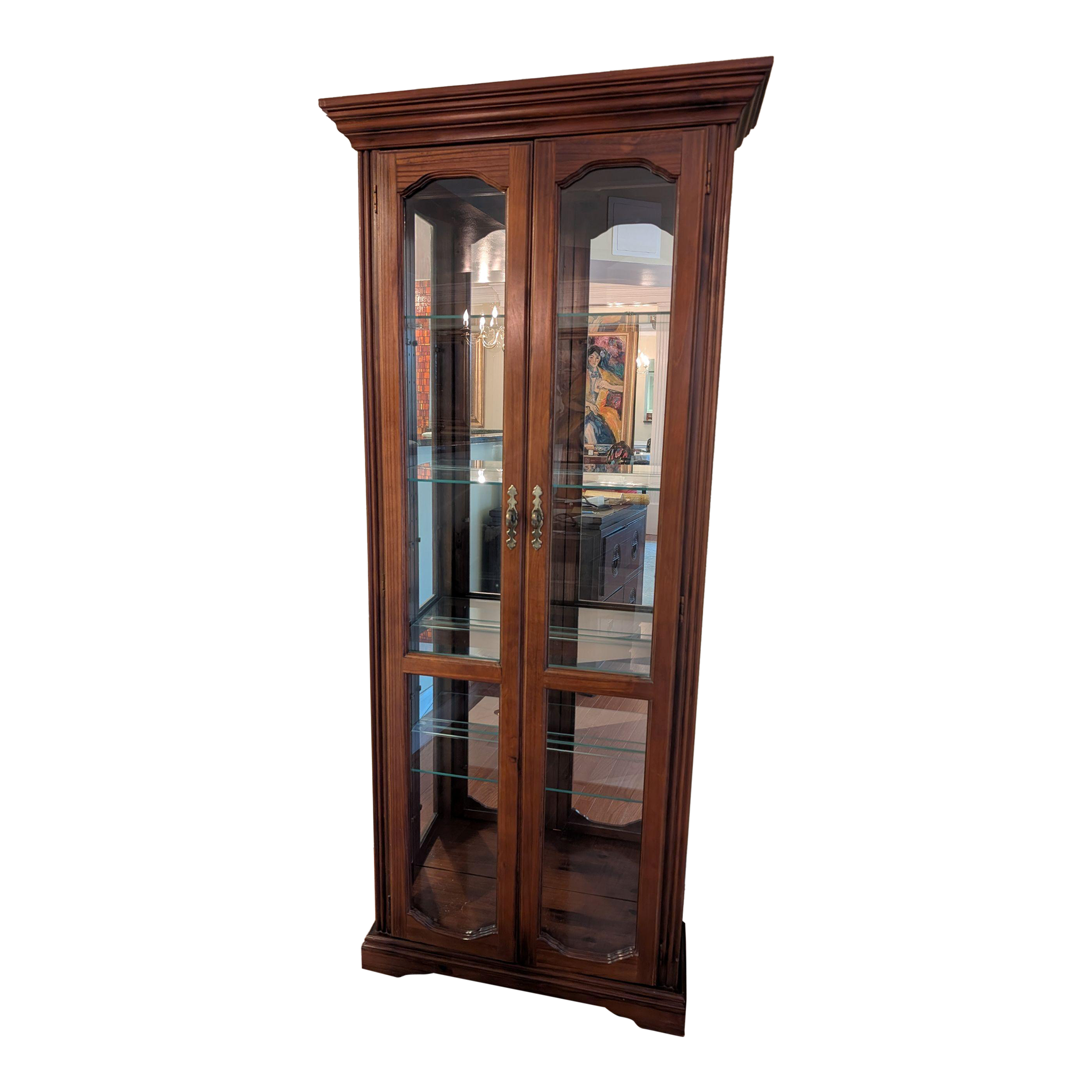 Dark wood curio cabinet with double doors on a white background.