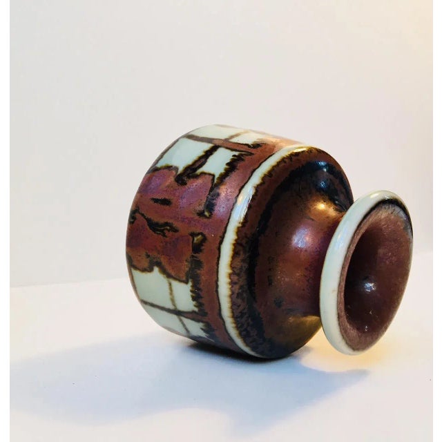 This small pottery vase designed by Danish ceramist Noomi Backhausen in the late 1960s was manufactured by Soholm. The...