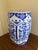A classic blue and white porcelain garden stool, decorated with traditional Chinese motifs and stylized floral elements....