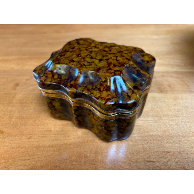 Borghese Ceramic lidded Box with a tourtise shell or marbleized finish. Gold trim with a blue interior. Beautiful simple,...