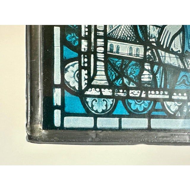 The original image depicted on painted glass is a scene of the Nativity of Our Lord from Chartres Cathedral in France....