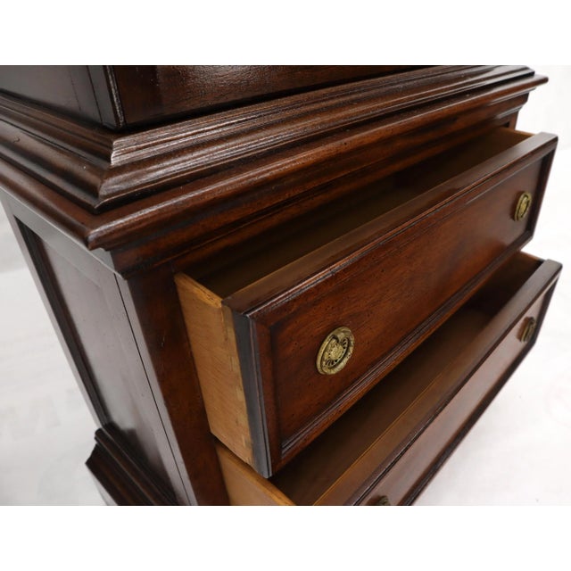 Lovely vintage curio display cabinet with glass shelves and 2 bottom drawers compartment. Has built in light.