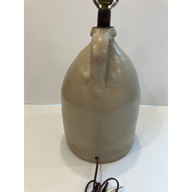 This American stoneware jug was made around 1850 The company is inscribed on the front E.H.Farrar North Bay Hand painted...
