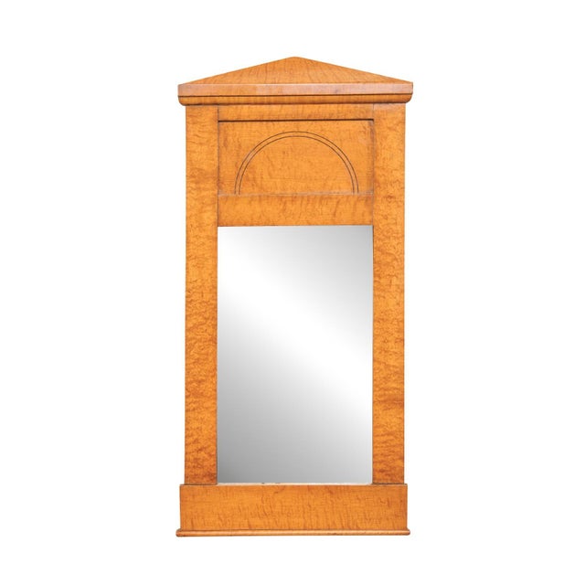A Swedish Karl Johan period wall mirror from the mid 19th century. This antique mirror from Sweden, has an architectural...