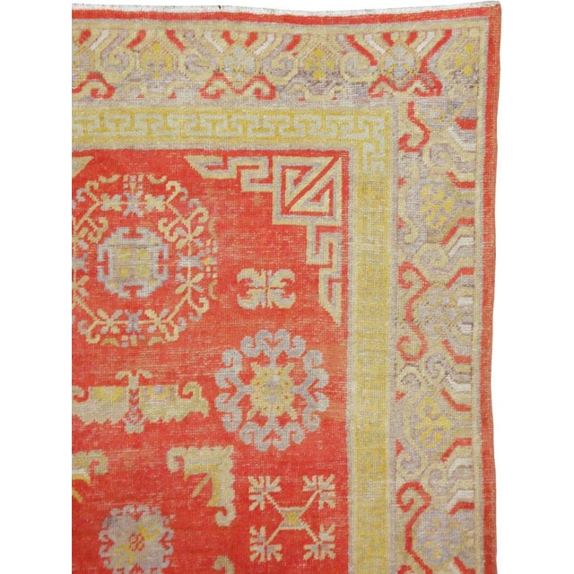 An antique East Turkestan Khotan carpet from the first quarter of the 20th century. Measures: 4' 5" x 8' 11"